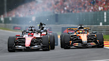 Debris flies after Charles Leclerc’s Ferrari makes contact with Oscar Piastri’s McLaren.