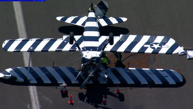 Vintage biplane lands upside-down at NSW airport