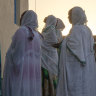 Orthodox Christian Tigrayan refugees who fled the conflict pray in front of a church at Hamdeyat Transition Centre in Sudan near the Ethiopian border.