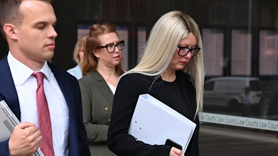 Elaine Stead, followed by her sister Olivia, outside the Federal Court in Sydney on Wednesday.