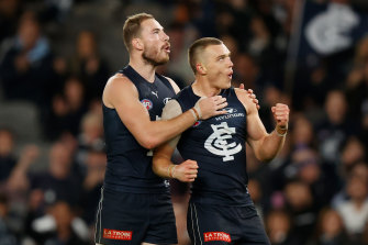 On song: Carlton’s Harry McKay, left, and Patrick Cripps celebrate.