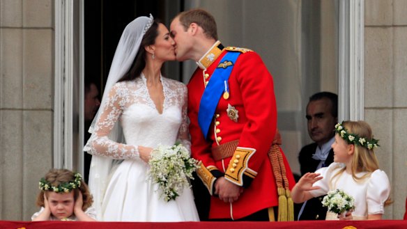 Prince William and Kate, Duchess of Cambridge kiss on the balcony of Buckingham Palace after their wedding in 2011.