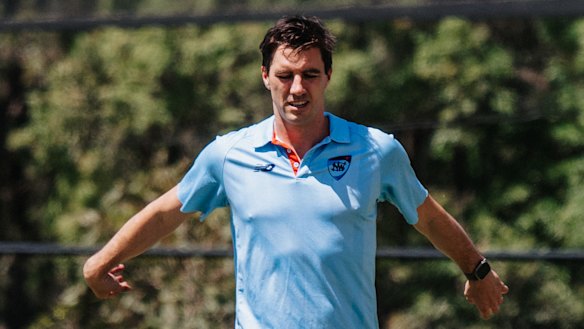 Pat Cummins warms up at Cricket NSW headquarters on Monday.