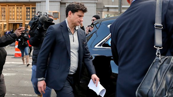 Charged: Gordon Caplan, co-chairman of  international law firm Willkie Farr & Gallagher, walks out of court on Tuesday.