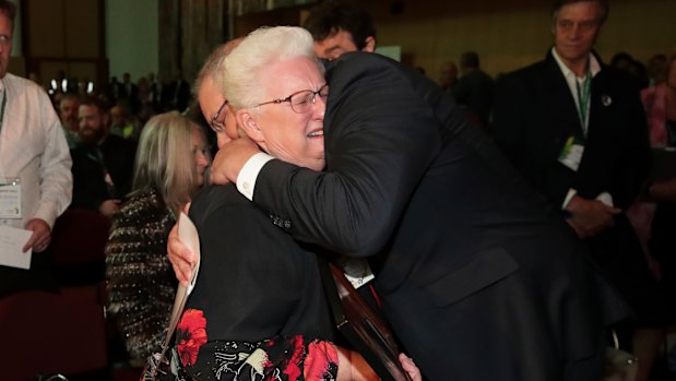 Mr Morrison is embraced by a survivor.