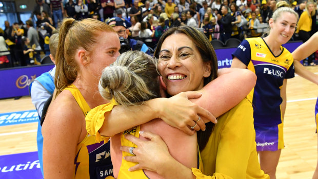 Sunshine Coast Lightning coach Noeline Taurua embraces Laura Scherian after their semi-final win against the NSW Swifts.