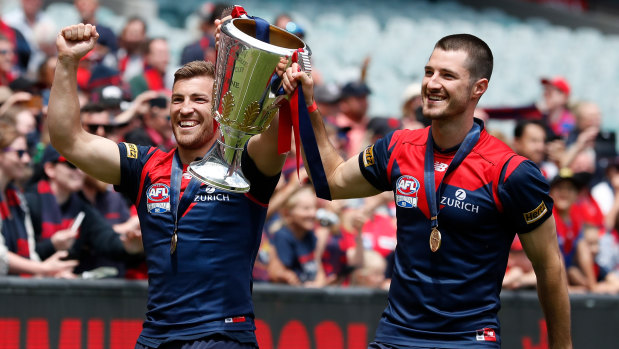 Jack Viney and Alex Neal-Bullen embark on a lap of honour. 