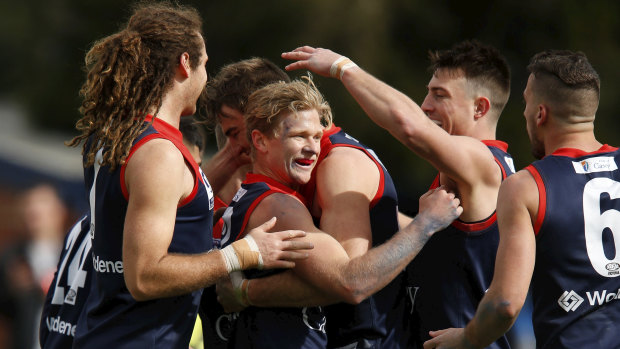 Dee-light: Casey players celebrate a goal during the VFL preliminary final against Essendon at Stannards Stadium in Port Melbourne on Saturday.