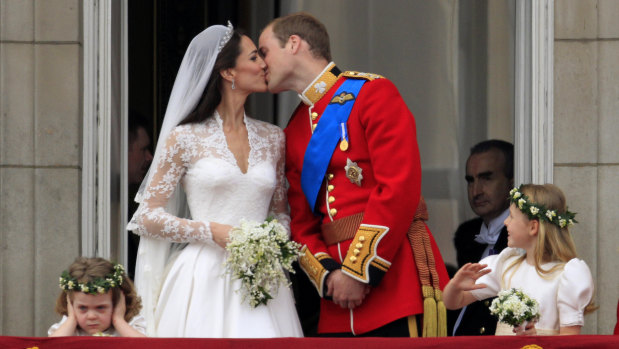 Prince William and Kate, Duchess of Cambridge kiss on the balcony of Buckingham Palace after their wedding in 2011.