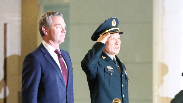 Australian Minister of Defence Christopher Pyne (right) and Chinese Minister of National Defence Wei Fenghe (centre) reviewing the PLA guards of honour in Beijing.