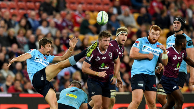 NSW halfback Jake Gordon clears the ball during a match against the Queensland Reds last year at Suncorp Stadium. 