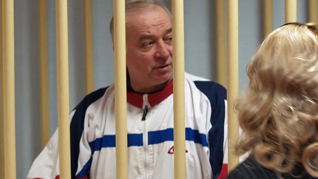 A photo dated August 9, 2006, shows Sergei Skripal talking from a defendants' cage to his lawyer during a hearing at the Moscow District Military Court.
