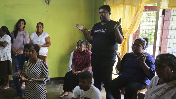 Relatives of Sri Lankan couple Rohan Marselas Wimanna and Mary Noman Shanthi, who were killed in Easter Sunday bomb blasts pray at their residence on the seventh day of mourning in Negombo, north of Colombo, Sri Lanka.