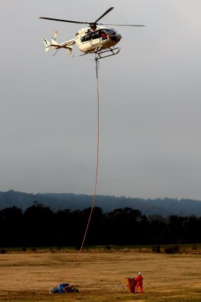 A waterbombing helicopter assisting with the effort further south at Bega. 