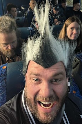 Zac Thomas on board one of the Collingwood buses heading to Adelaide for Thursday’s qualifying final.