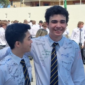 Finn Lip (right) celebrating his final day at Christ Church Grammar School.