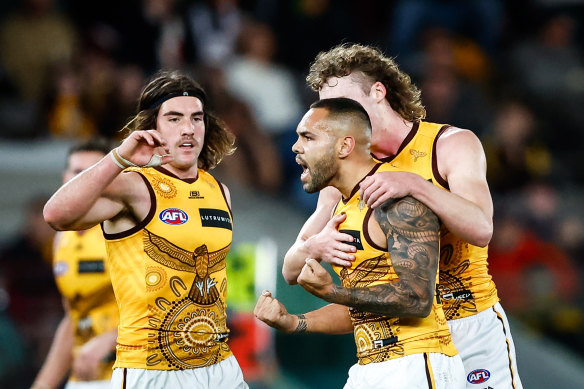 Jarman Impey and the Hawks celebrate a goal.