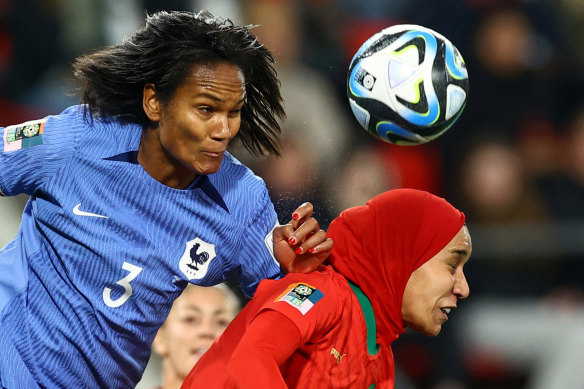 France’s Wendie Renard and Morocco’s  Nouhaila Benzina contest a header in their round of 16 match.