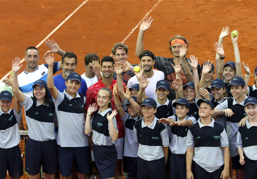 Djokovic poses with players and volunteers at his ill-fated Adria Tour.