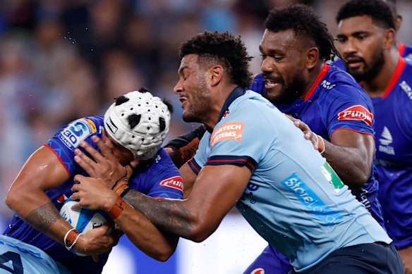 Isaiah Armstrong-Ravula of Fijian Drua is tackled