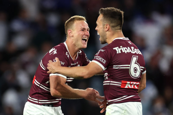 Daly Cherry-Evans celebrates with Luke Brooks.
