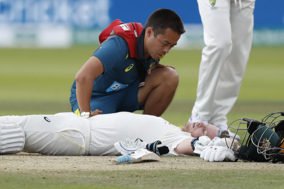 Steve Smith receives medical assistance after being hit in the neck by Jofra Archer at Lord’s in 2019. He left the field but returned to bat once Peter Siddle was dismissed.