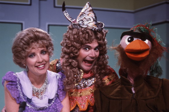 Jacki MacDonald, Daryl Somers and Ozzie Ostrich in costumes.