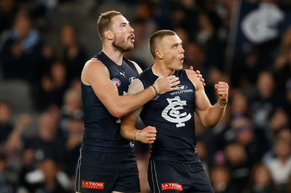 On song: Carlton’s Harry McKay, left, and Patrick Cripps celebrate.