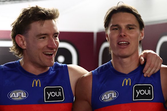 Lions skipper Harris Andrews looks pleased to have teammate Eric Hipwood (right) back in the team after a long injury lay-off.