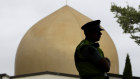 A police officer stands in a park near the Al Noor mosque in Christchurch, New Zealand