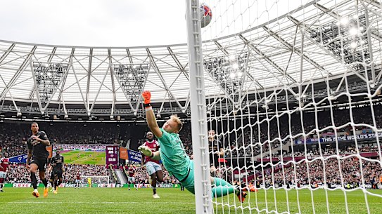 Jarrod Bowen beats Arsenal goalkeeper Aaron Ramsdale to score for West Ham.