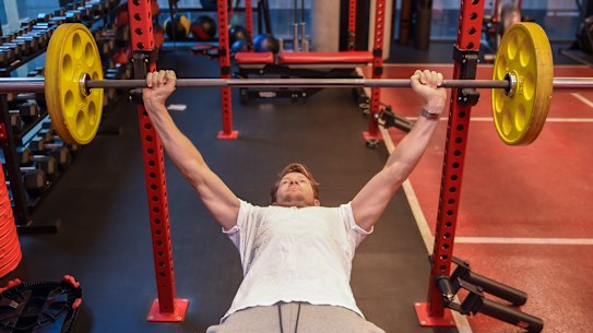 Physiotherapist Luke Pickett performing a bench press.
