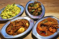 Dishes of egg, cabbage, prawns with okra, and dry pork at Toddy Shop.