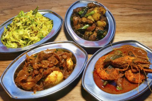 Dishes of egg, cabbage, prawns with okra, and dry pork at Toddy Shop.