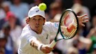 Alex De Minaur plays a backhand.