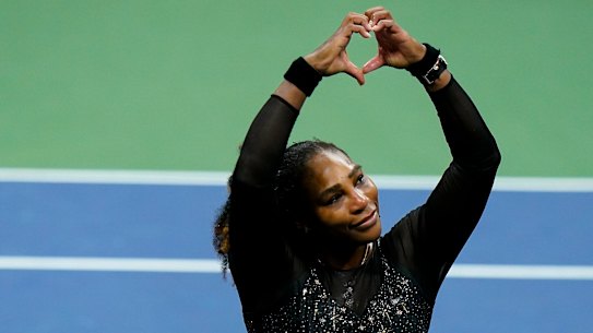 Serena Williams departs from the stage, making a heart to fans after her loss in the US Open.