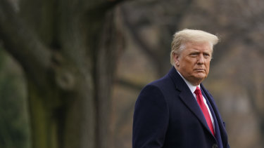 US President Donald Trump walks on the South Lawn of the White House before boarding Marine One on Saturday.