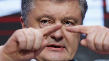 Ukrainian President Petro Poroshenko declares the time for jokes is over as initial exit poll results show him running a distant second.