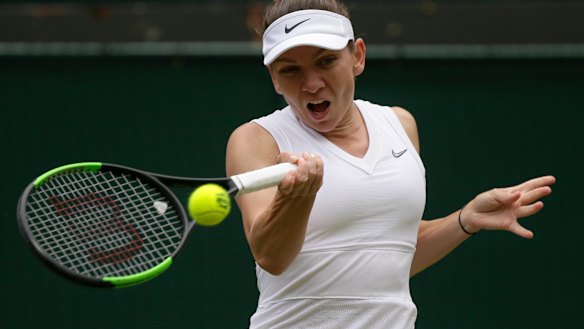 Romania's Simona Halep returns the ball to China's Shuai Zhang en route to the Wimbledon semi-finals.
