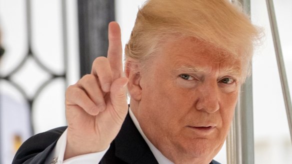 Donald Trump signals to the press that he will come over to talk.