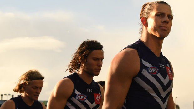 Nat Fyfe leads his players from the ground after the Geelong thrashing.