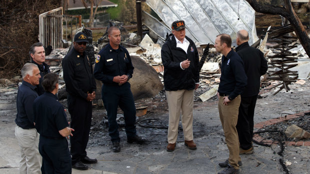 Donald Trump visits a neighbourhood impacted by the Wolsey Fire in Malibu, California, last week.