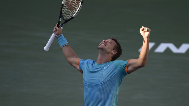 Victorious: Philipp Kohlschreiber celebrates his win over Novak Djokovic.
