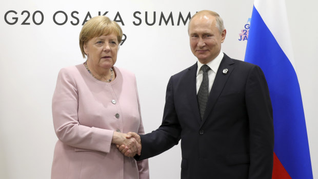 German Chancellor Angela Merkel shake hands with Russian President Vladimir Putin in a meeting on the sidelines of the G20 summit.