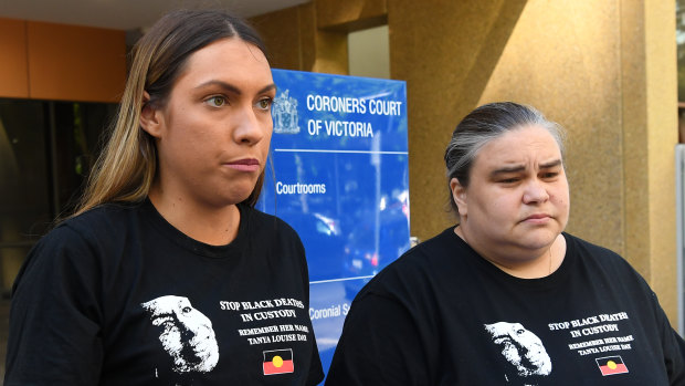 Tanya Day's daughters Apryl Watson, left, and Belinda Day address the media outside the coroner's court in Melbourne last year. 
