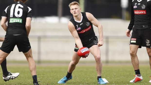 Handy work: Adam Treloar completes handball drills.