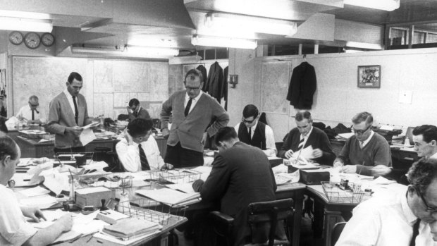 The Herald sub-editors’ desk, seen here in 1968, hadn’t changed much by the time Richard Glover got there in 1983.