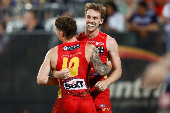 Humphrey (left) and Noah Anderson celebrate another Suns goal.