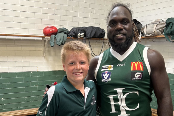 Charlie Dunn, 11, and former Essendon player Anthony McDonald-Tipungwuti.