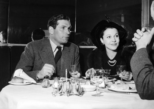Sir Laurence Olivier and Lady Olivier at Romano's restaurant.